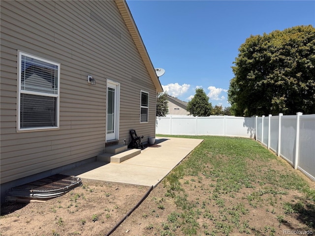 6836 Loudon St, Wellington, CO 80549 - fenced backyard featuring a patio and entry steps