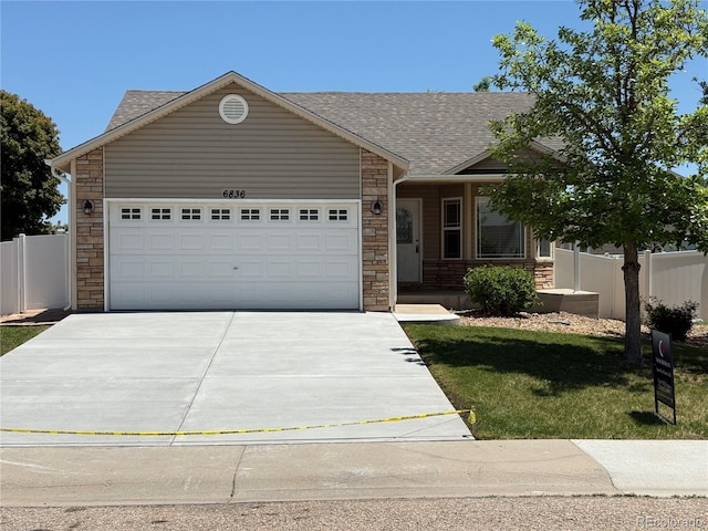 6836 Loudon St, Wellington, CO 80549 - ranch-style house with stone siding, concrete driveway, a garage, and a shingled roof