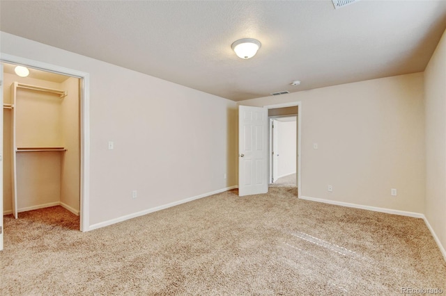6836 Loudon St, Wellington, CO 80549 - unfurnished bedroom with carpet floors, a walk in closet, and a closet