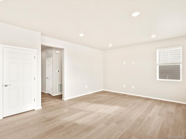 unfurnished room featuring light wood-type flooring