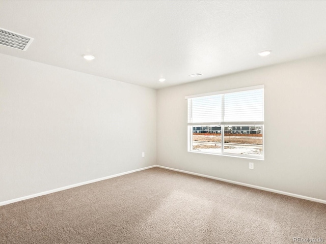 empty room with carpet flooring