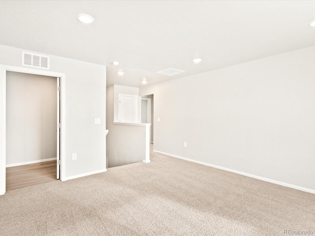 empty room with light colored carpet