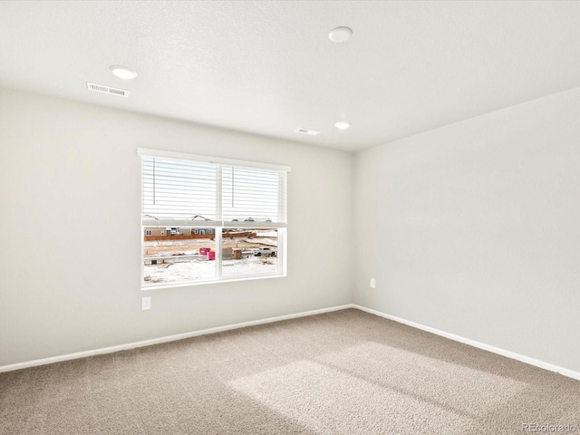 unfurnished room featuring carpet flooring