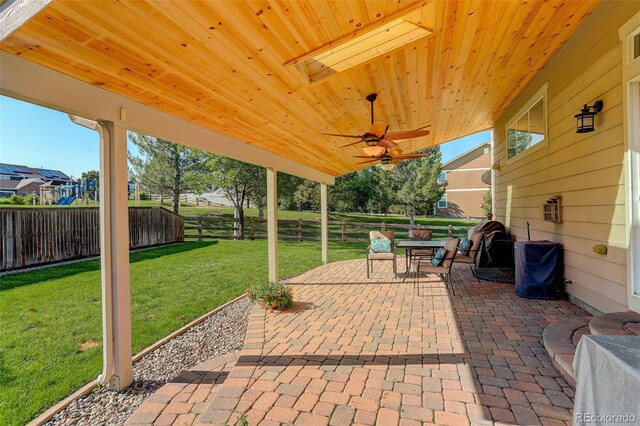15122 Fillmore Way, Thornton, CO 80602 - fenced backyard featuring a patio area and ceiling fan