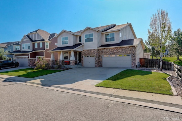 15122 Fillmore Way, Thornton, CO 80602 - view of front of house featuring an attached garage, stone siding, concrete driveway, and a residential view