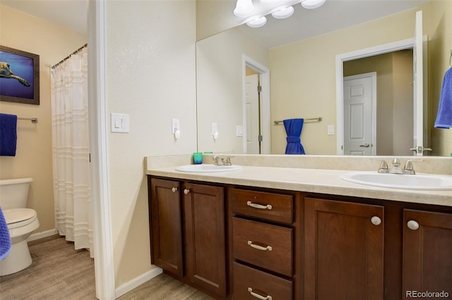 15122 Fillmore Way, Thornton, CO 80602 - bathroom featuring wood finished floors and double vanity