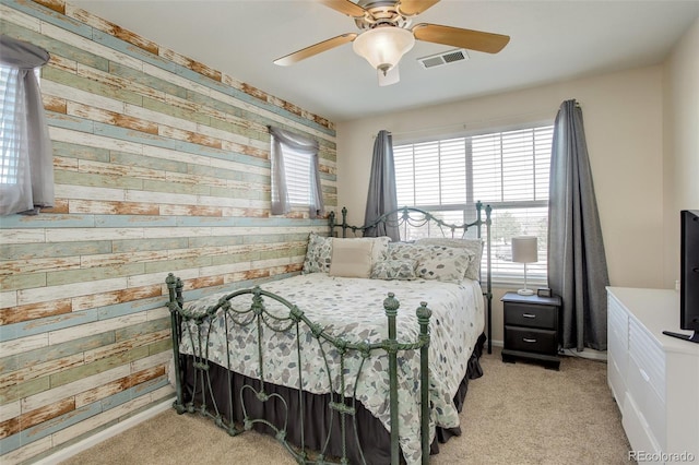 15122 Fillmore Way, Thornton, CO 80602 - bedroom featuring wooden walls, light carpet, and a ceiling fan