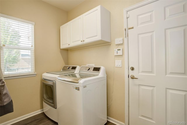 15122 Fillmore Way, Thornton, CO 80602 - laundry area featuring washing machine and dryer, cabinet space, and dark wood-style flooring