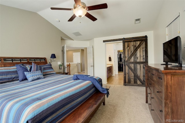 15122 Fillmore Way, Thornton, CO 80602 - bedroom with a barn door, vaulted ceiling, light carpet, and ceiling fan