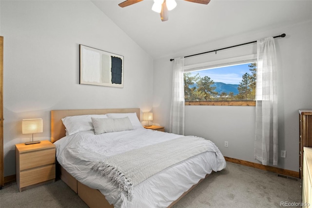 carpeted bedroom with lofted ceiling, ceiling fan, visible vents, and baseboards