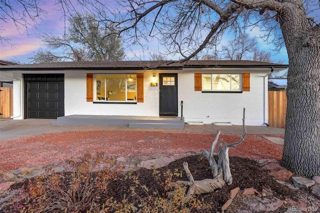 ranch-style home featuring a garage