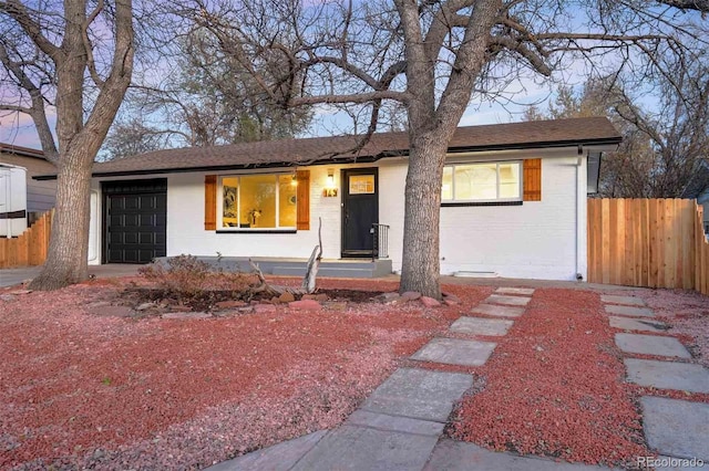 ranch-style home featuring a garage