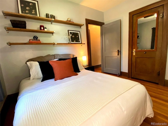 620 Walnut St, Windsor, CO 80550 - bedroom with wood finished floors and baseboards