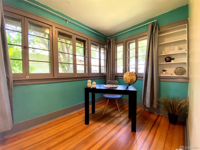 620 Walnut St, Windsor, CO 80550 - home office with wood finished floors and baseboards