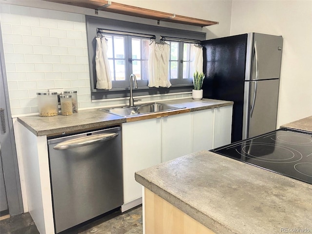 620 Walnut St, Windsor, CO 80550 - kitchen featuring appliances with stainless steel finishes, white cabinets, and backsplash