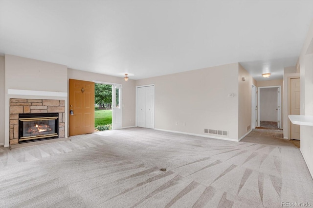 8406 Everett Way Unit C, Arvada, CO 80005 - unfurnished living room with light colored carpet and a fireplace