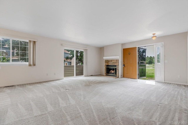 8406 Everett Way Unit C, Arvada, CO 80005 - unfurnished living room with carpet floors and a fireplace