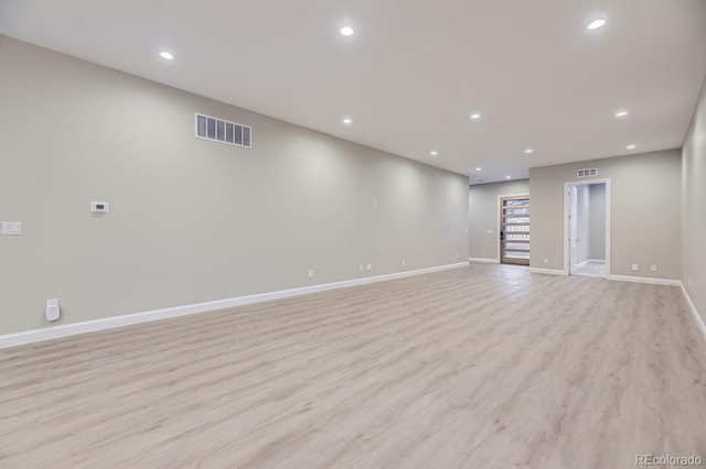 unfurnished room with light hardwood / wood-style floors