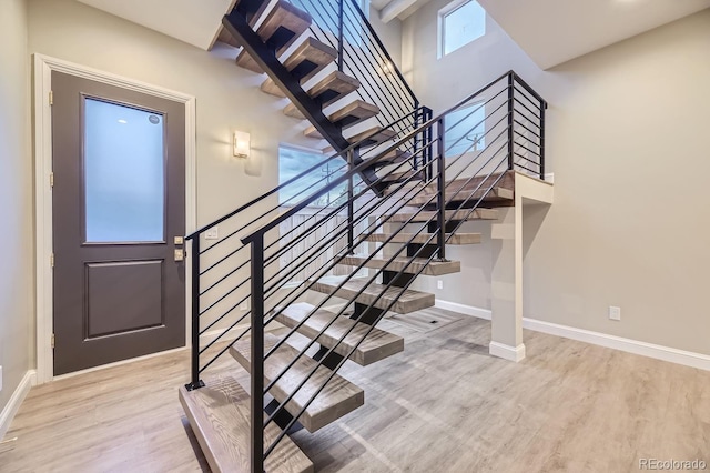 stairway with wood-type flooring