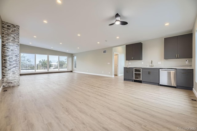 kitchen with light wood-type flooring, dishwasher, beverage cooler, lofted ceiling, and ceiling fan