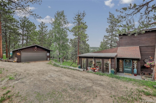 119 Yew Ln, Bailey, CO 80421 - view of yard with a detached garage and an outbuilding