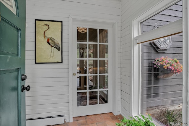 119 Yew Ln, Bailey, CO 80421 - view of exterior entry with a baseboard heating unit
