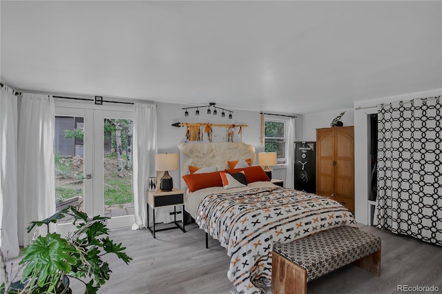 119 Yew Ln, Bailey, CO 80421 - bedroom with wood finished floors and access to outside