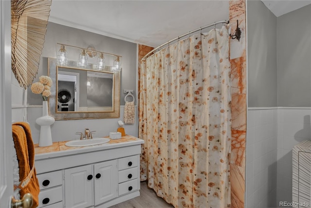 119 Yew Ln, Bailey, CO 80421 - bathroom with vanity, tile walls, curtained shower, and wood finished floors