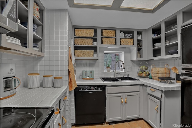 119 Yew Ln, Bailey, CO 80421 - kitchen with black dishwasher, tile counters, backsplash, and range with electric stovetop