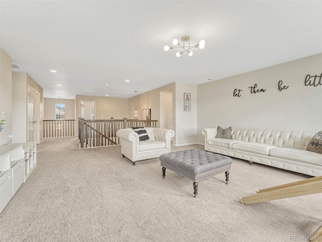 living room with light carpet and a chandelier