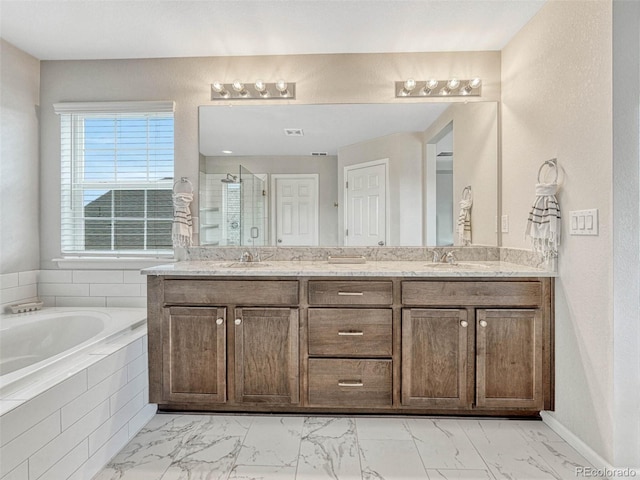 bathroom with shower with separate bathtub and vanity