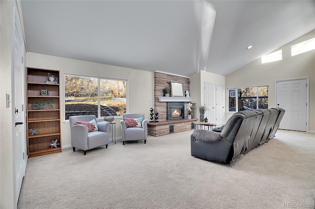 carpeted living room featuring a fireplace and high vaulted ceiling