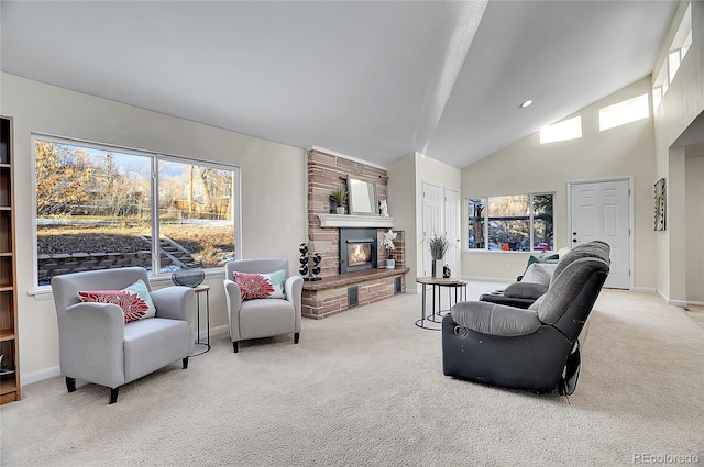 living room with high vaulted ceiling, a fireplace, light carpet, and a wealth of natural light