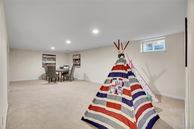 recreation room with light carpet