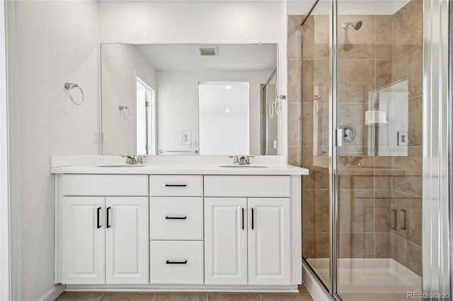 bathroom with vanity and an enclosed shower