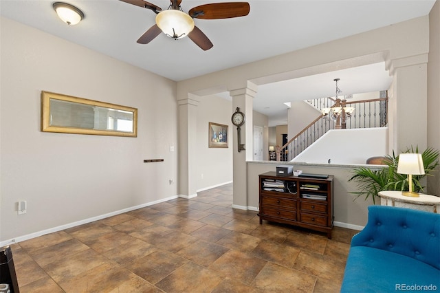 13753 Monroe St, Thornton, CO 80602 - living room featuring a ceiling fan, a chandelier, stairway, and stone finish flooring