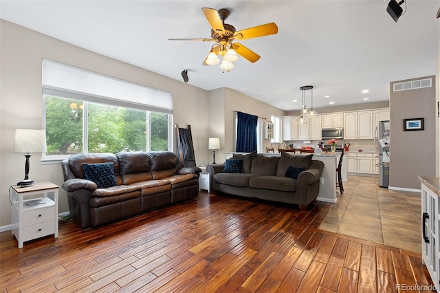 13753 Monroe St, Thornton, CO 80602 - living area with light wood-type flooring, ceiling fan, a chandelier, and recessed lighting
