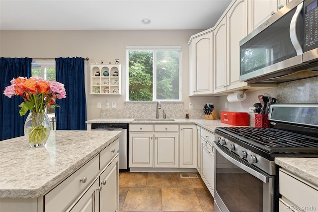 13753 Monroe St, Thornton, CO 80602 - kitchen featuring appliances with stainless steel finishes, plenty of natural light, white cabinets, and recessed lighting