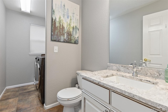 13753 Monroe St, Thornton, CO 80602 - bathroom with washer and clothes dryer and vanity