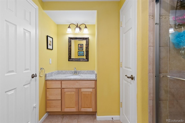 13753 Monroe St, Thornton, CO 80602 - bathroom featuring vanity, a tile shower, and tile patterned flooring