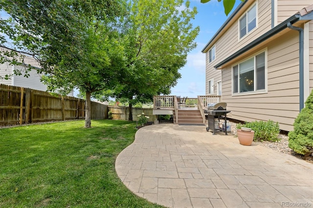 13753 Monroe St, Thornton, CO 80602 - fenced backyard with a patio and a wooden deck