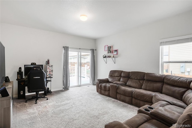 481 Vista Blvd, Brighton, CO 80603 - living area with carpet flooring, healthy amount of natural light, an office area, and baseboards