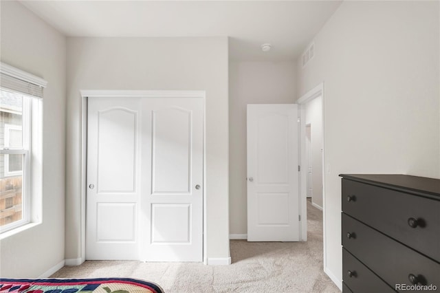 481 Vista Blvd, Brighton, CO 80603 - unfurnished bedroom with light carpet, baseboards, and a closet