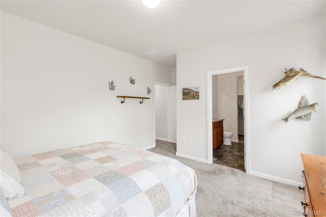 481 Vista Blvd, Brighton, CO 80603 - bedroom featuring light carpet and baseboards