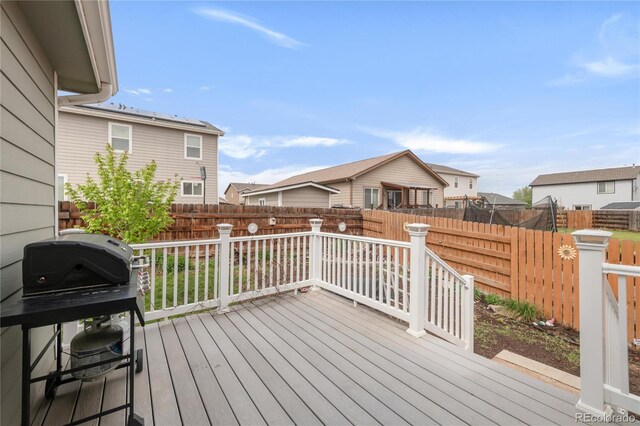 481 Vista Blvd, Brighton, CO 80603 - wooden terrace featuring a fenced backyard and a residential view