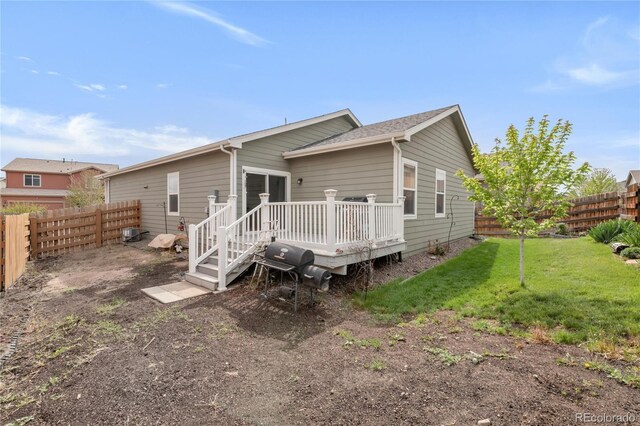 481 Vista Blvd, Brighton, CO 80603 - rear view of house with a wooden deck