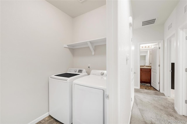 481 Vista Blvd, Brighton, CO 80603 - laundry area featuring washing machine and clothes dryer, baseboards, and light carpet