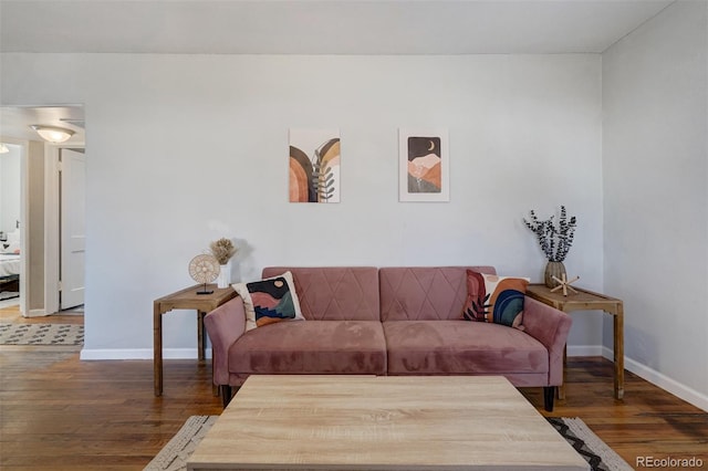 living room featuring dark wood finished floors and baseboards