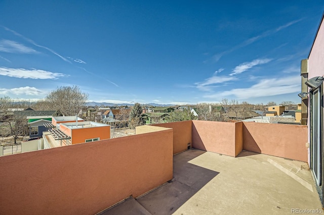 view of patio / terrace featuring a balcony and a residential view