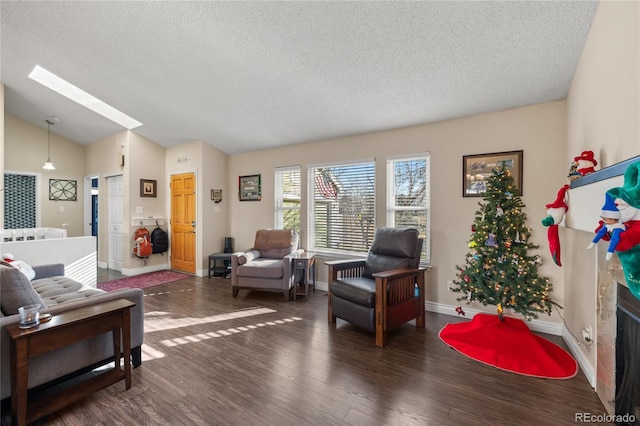 living room with a textured ceiling, dark hardwood / wood-style flooring, and vaulted ceiling